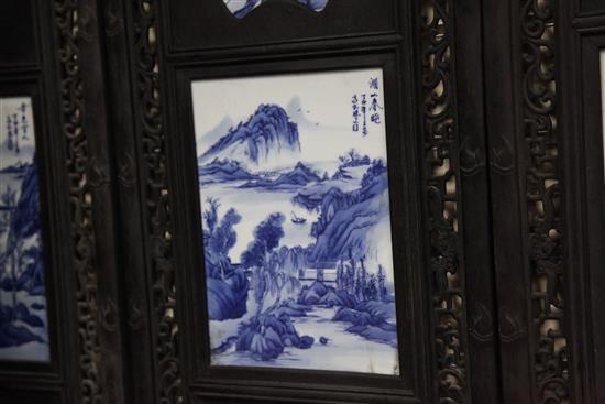 A set of four Chinese blue and white porcelain mounted wood panels, 121.5 x 38cm